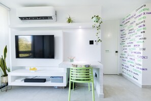 TV and desk area with inverter for common areas