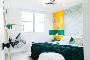 Cozy and comfy room with king bed and hanging hammock