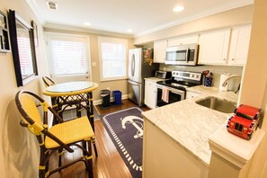 The kitchen has seating for 2 and overlooks the sunny back patio.