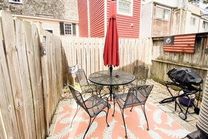 Soak in the sunshine in the private fenced-in back patio has with a grill and seating for 4.