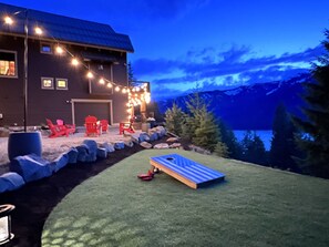 The newly landscaped back yard! 40ft of plush turf, cornhole & a firepit area.