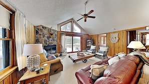 Living room- nicely decorated with comfy overstuffed couches