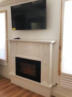 Smart T.V. over the beautiful fireplace!