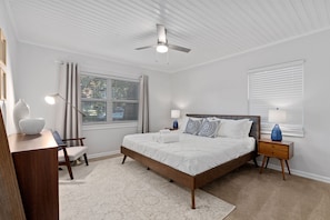 this bedroom features a king mattress with a 6 drawer dresser and a large closet