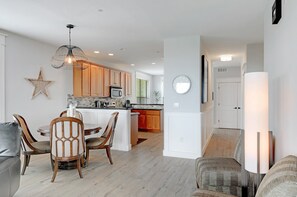 Dining / kitchen with view down hallway to bedroom 2 and 3