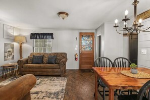 The main living area has plenty of seating to relax or enjoy the TV.