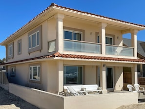Two story, Mediterranean home with balconies off 4 bedrooms.