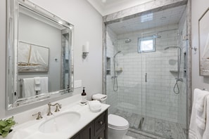Luxury bathroom with heated floors and dual showers