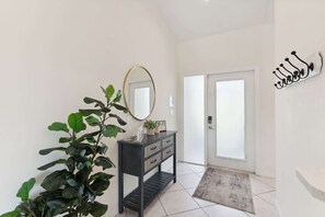The main entry foyer welcomes guests into the home 