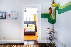 Peek into the Gold Suite from this groovy corner of the home, it is equipped with a comfortable king bed, noise machine, a smart TV + Chromecast.