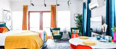 This bright, colorful studio lives large with vaulted ceilings and vibrant furnishings. A washer/dryer is in the unit to make laundry super easy!