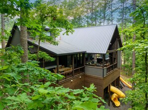 Enjoy the 1,200 sq foot covered deck while the kids play below.