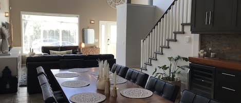 Open concept living space with three story ceiling