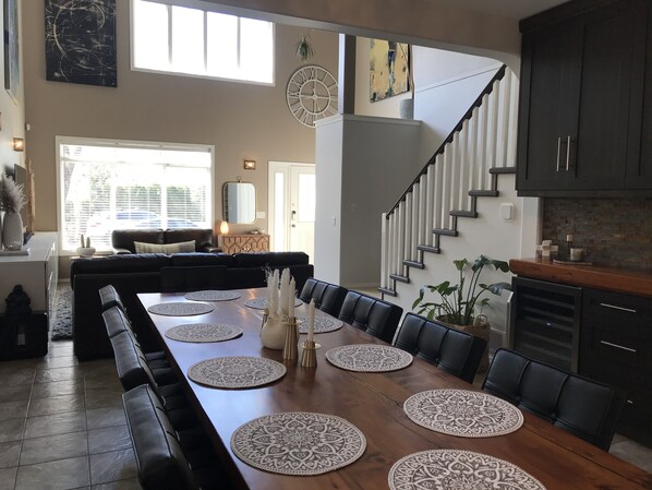 Open concept living space with three story ceiling