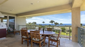 Lanai dining expands living area.  Who would ever dine indoors with this view?