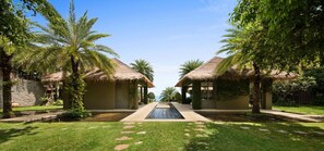 Sangsuri Villa 2 has chic outdoor spaces decorated by greenery and ponds