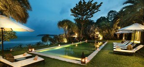 The upper level infinity pool has interrupted beach views