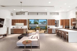 Seamlessly blending modern style and comfort, this open-concept kitchen and living area is perfect for relaxing or entertaining.