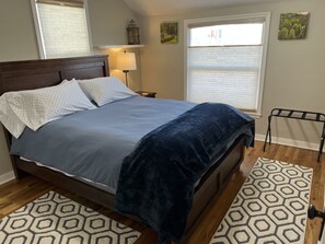 Main floor East bedroom. Queen size bed with Comfy mattress and down comforter. 