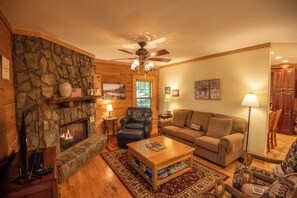 Couch and a cozy leather chair for reading...