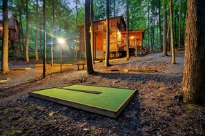 Back of cabin with private 6 hole lighted mini-golf