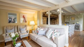 Original beams adorn the ceilings above