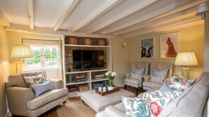 Curl up in comfort in the living room with a good book or a film
