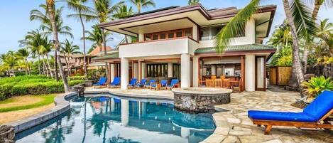 This luxury, 2-story oceanfront estate on Big Island boasts one of the best locations on the entire Kona coast