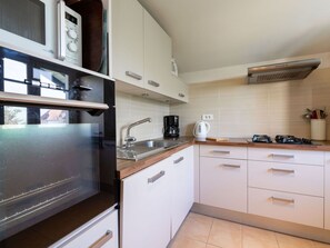 Cabinetry, Countertop, Furniture, Building, Kitchen, Kitchen Appliance, Kitchen Stove, Wood, Home Appliance, Flooring