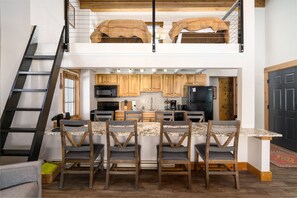 Two twin beds in the loft accessible by the ladder.