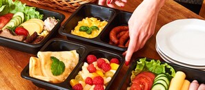 A promotional image showcasing a table set with a variety of appetizing dishes.