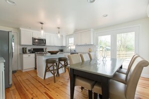 A beautifully remodeled kitchen and dining room.