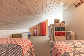 Cozy loft area with 2 twin beds, perfect for children or young adults!