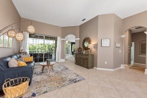 Sitting room.  Master suite to the left.  Dining room open to the right.  Guest bedrooms through right hallway.  Kitchen and living room forward and right.