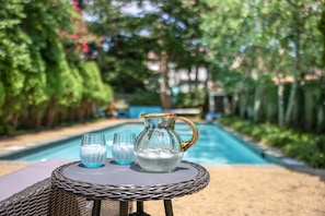 Refreshing beverage by the full size pool. Sun-loungers and shade umbrella. Yes!