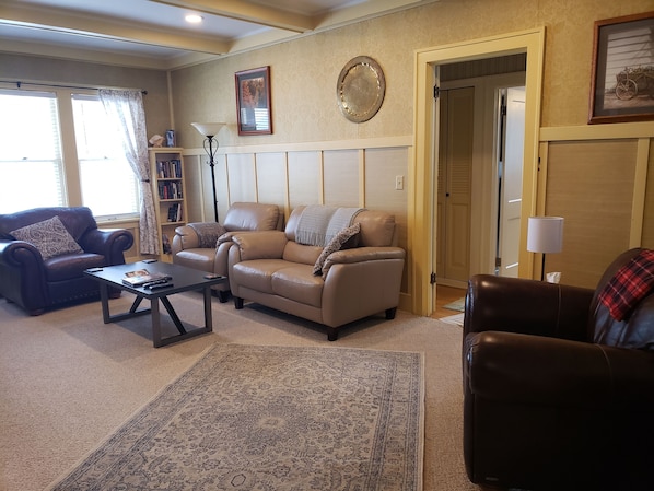 Living room featuring leather furniture, Smart TV, premium HD cable, DVD player