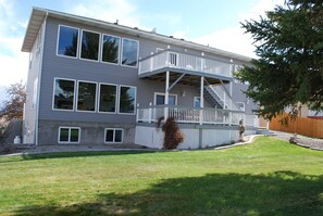 Two decks at the rear of the home, overlooking the large yard and Snake River.