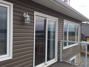 patio door on deck in front of house