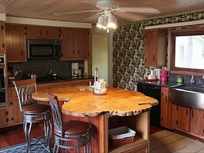 Hand crafted wooden island gives this kitchen some character!