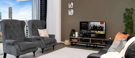 Spacious living area with smart TV and views