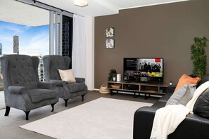 Spacious living area with smart TV and views