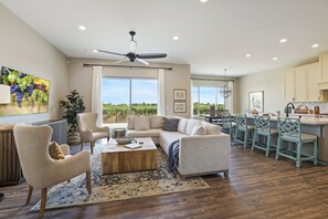 Family room with large flat screen wall-mounted TV