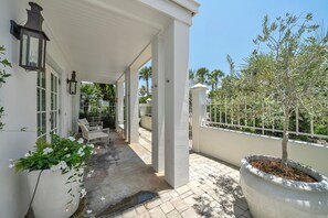 Charming Front porch with comfortable seating for all your guests.