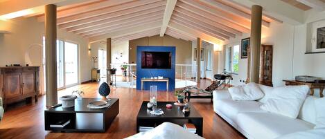 Sofas, big TV, arm chair, Air condition and Wifi in your villa. 