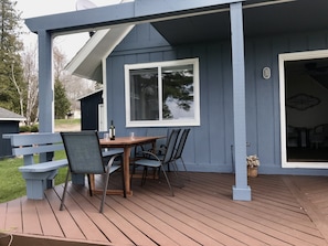 Room for the whole family to gather for a casual dinner or games on the deck