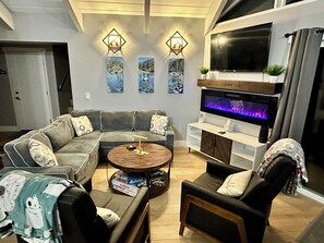 Livingroom with convertible couch to queen bed and family games