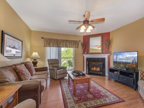Spacious Living Room - Large comfortable couches, a flat screen TV, and ceiling fan so you can enjoy your evenings with family and lots of breathing space.