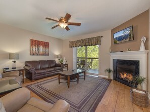 Living Room - Fireplace + Balcony Access