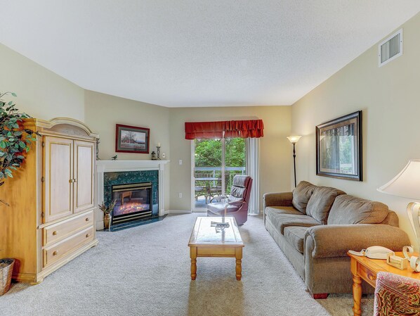 Welcome to Pigeon Forge Dream Whispering Pines 423! Living Room with balcony access and sofa sleeper