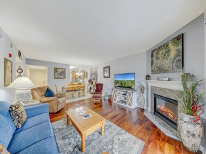 Living Room with Fireplace and Balcony Access